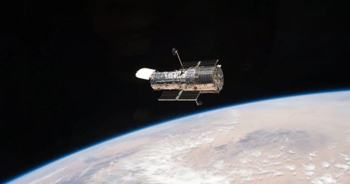 A Figure-Eight in Deep Space: Hubble Image Shows Gravity Warping Distant Galaxies