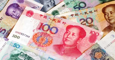 Chinese banks raise dollar deposit rates to counter yuan strength