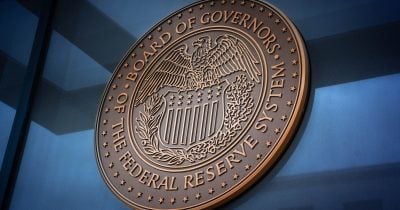 Fed maintains rates; market speculates on 2026 hike amid split committee