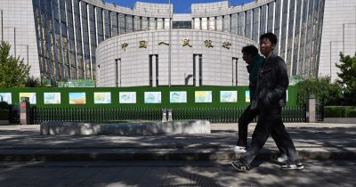 China reserve gauge hits 12-year high, smoothing yuan rise