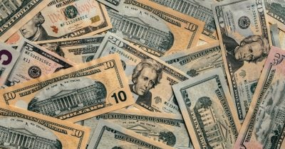 US dollar dips to C$1.3877 as Trump hits pause on 50% Canadian tariffs